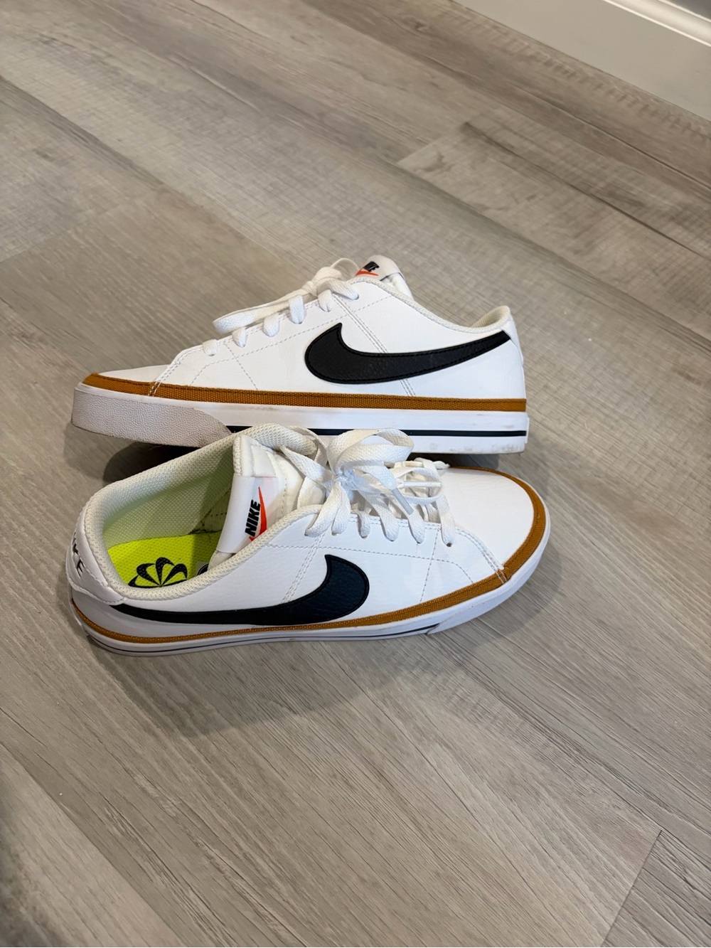 Nike White Sneakers with Black Swoosh and Tan Trim